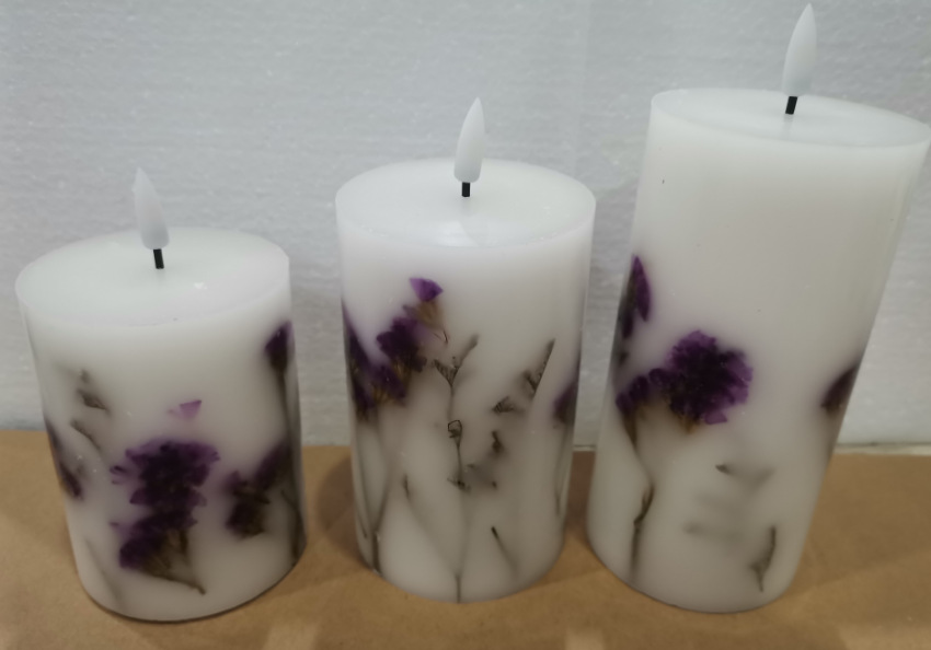 Purple floral wax candles in three heights
